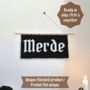 tapisserie "merde" à suspendre